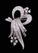 A scrolled foliate diamond brooch, circa 1950   A scrolled foliate diamond brooch,   circa 1950, the