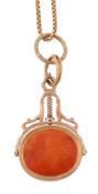 A swivel seal, the oval shaped cornelian carved with a crest and a monogram   A swivel seal,   the