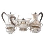 A matched silver five piece tea service, the tea pot by Elkington  &  Co   A matched silver five