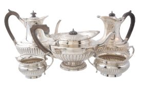 A matched silver five piece tea service, the tea pot by Elkington  &  Co   A matched silver five