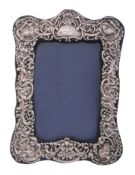 An Edwardian silver mounted photograph frame by W. J. Myatt  &  Co   An Edwardian silver mounted