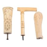 Three waking stick handles, comprising: an angled ivory example   Three waking stick handles,
