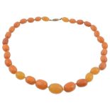 An amber bead necklace, the single strand necklace composed of graduating...   An amber bead