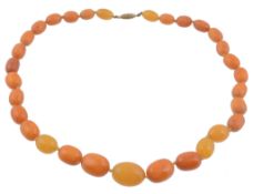 An amber bead necklace, the single strand necklace composed of graduating...   An amber bead