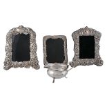 Three various silver mounted shaped rectangular embossed photograph frames   Three various silver