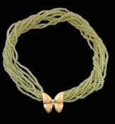 A peridot bead necklace, composed of polished circular cut peridot beads   A peridot bead necklace,