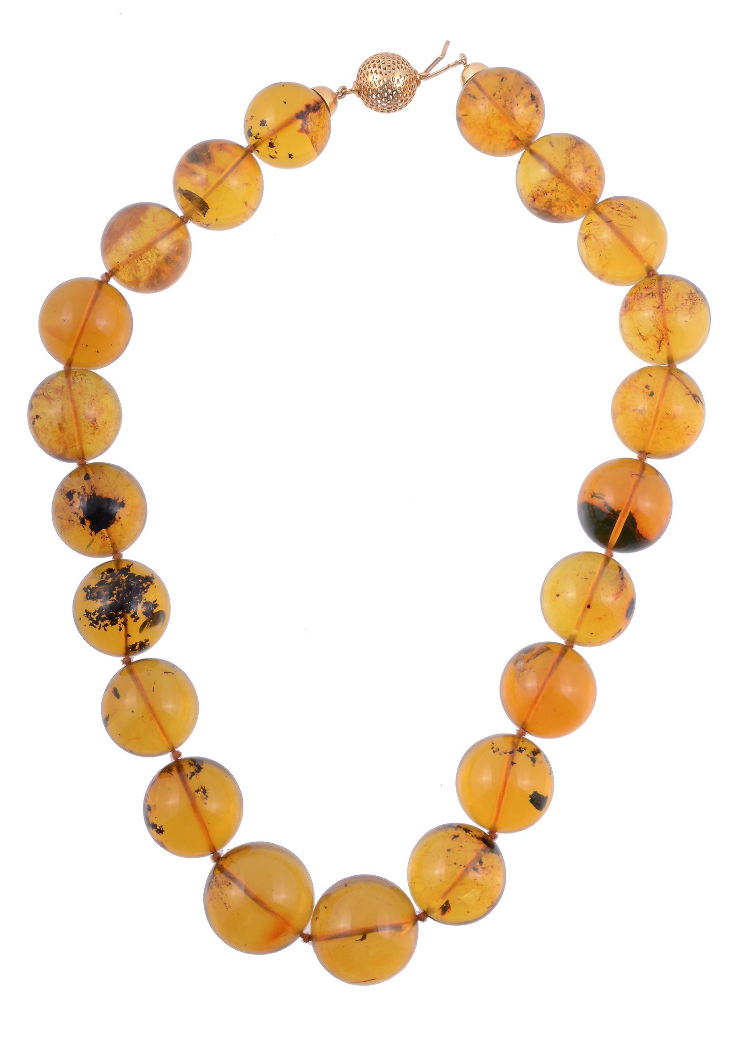 An amber bead necklace, the necklace composed of uniform circular shaped...   An amber bead