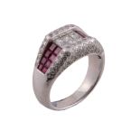 A ruby and diamond ring, the panel set with square cut diamonds between...   A ruby and diamond