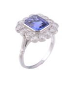 A tanzanite and diamond ring, the central rectangular cut tanzanite collet...   A tanzanite and