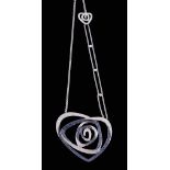 A sapphire and diamond pendant, the abstract heart shaped rose pendant set...   A sapphire and