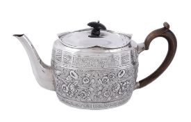 A late Victorian silver oval tea pot by William Comyns, London 1898   A late Victorian silver oval