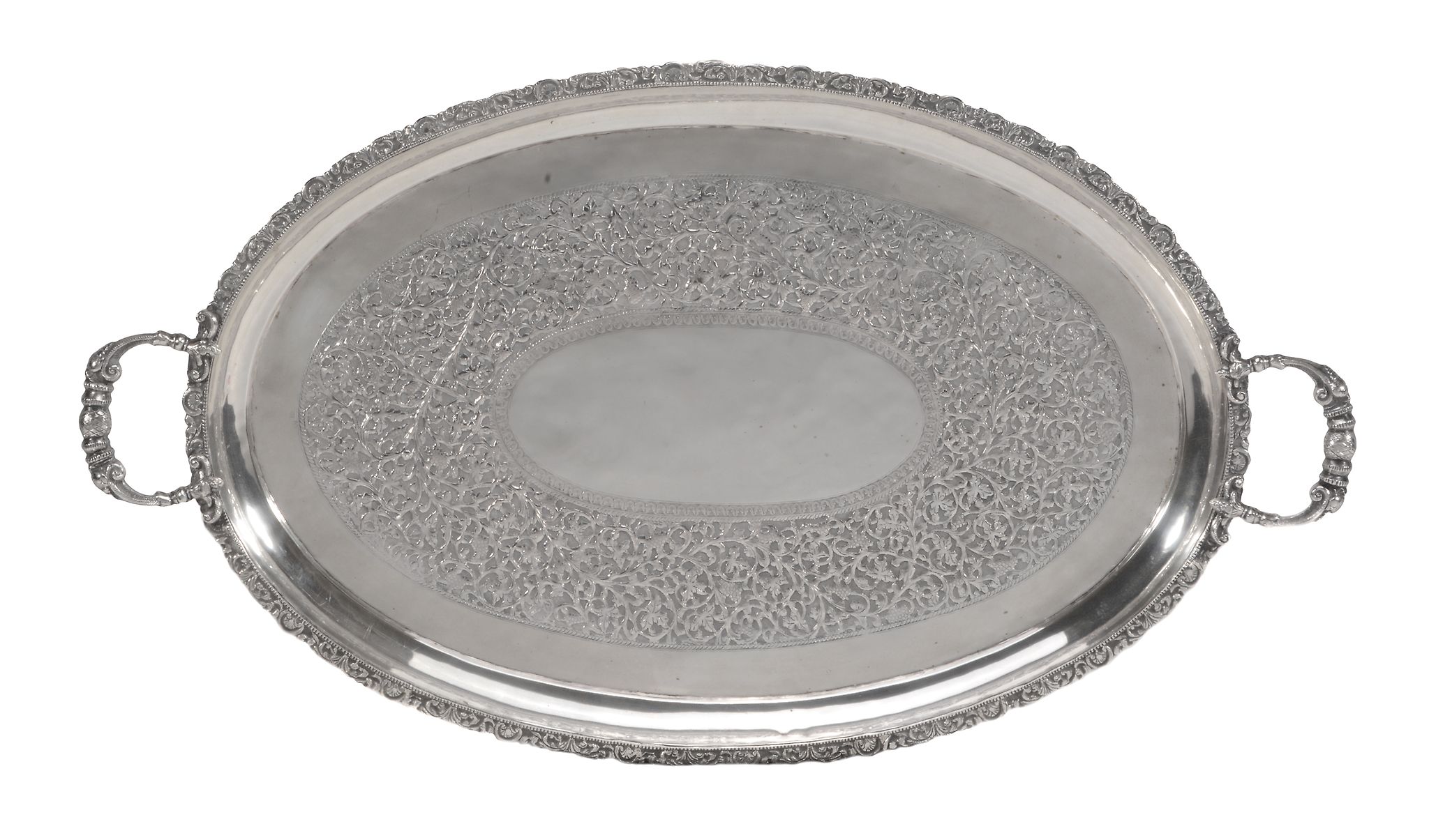 A Cambodian silver coloured shaped oval twin handled tray   A Cambodian silver coloured shaped