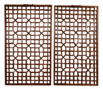 A pair of Chinese hardwood lattice window panels, with metal handles to the top   A pair of