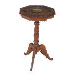 A Swiss carved pine, beech and polychrome painted tripod table, circa 1870   A Swiss carved pine,