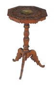 A Swiss carved pine, beech and polychrome painted tripod table, circa 1870   A Swiss carved pine,