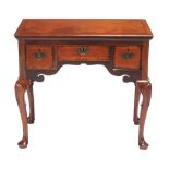 A mahogany side table in George II style, 18th century and later elements   A mahogany side table in