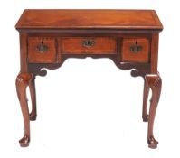 A mahogany side table in George II style, 18th century and later elements   A mahogany side table in