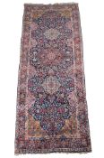 A Kirman carpet, approximately 190 x 481cm A Kirman carpet, approximately 190 x 481cm The estimate