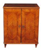 A Continental palewood and string inlaid two door cabinet, mid 19th century   A Continental palewood