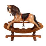 A mixed wood child's rocking horse , of recent manufacture, with brass plaque A mixed wood child's