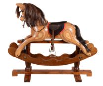 A mixed wood child's rocking horse , of recent manufacture, with brass plaque A mixed wood child's