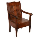 An oak panel back armchair , first half 18th century, 104cm high, 61cm wide   An oak panel back