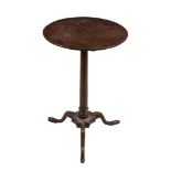 A GeorgeII mahogany tripod table, circa 1750, 70cm high, the top 46cm diameter   A GeorgeII mahogany