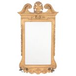A carved and giltwood wall mirror in George II style , 19th century   A carved and giltwood wall