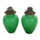 A pair of Chinese green glass ovoid vases, 20th century A pair of Chinese green glass ovoid vases,