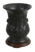 A Chinese archaic style bronze, the flared neck and ovoid body cast with...   A Chinese archaic