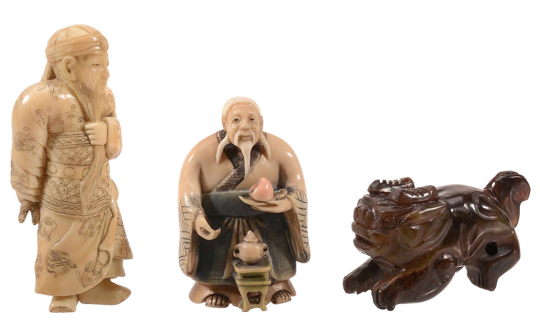 An Ivory Netsuke of Kwanyu, the bearded general stands wearing elaborate...   An Ivory Netsuke of