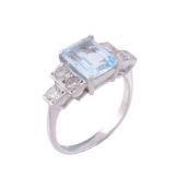 An aquamarine and diamond ring, the central rectangular cut aquamarine in a...   An aquamarine and