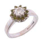 A diamond and green tourmaline cluster ring A diamond and green tourmaline cluster ring, the