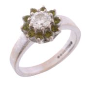A diamond and green tourmaline cluster ring A diamond and green tourmaline cluster ring, the