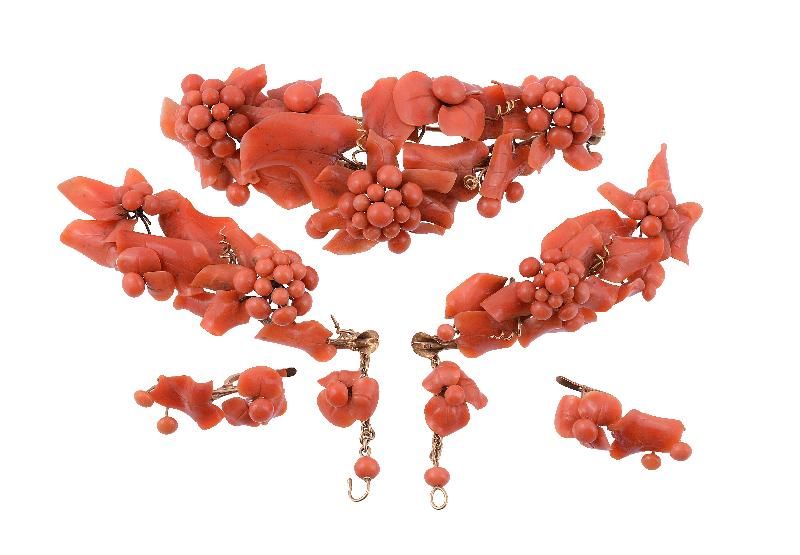 A coral brooch and side panels, the coral in the form of twisting clusters...   A coral brooch and