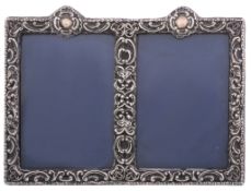 An Edwardian silver mounted double photograph frame, maker's mark J   An Edwardian silver mounted