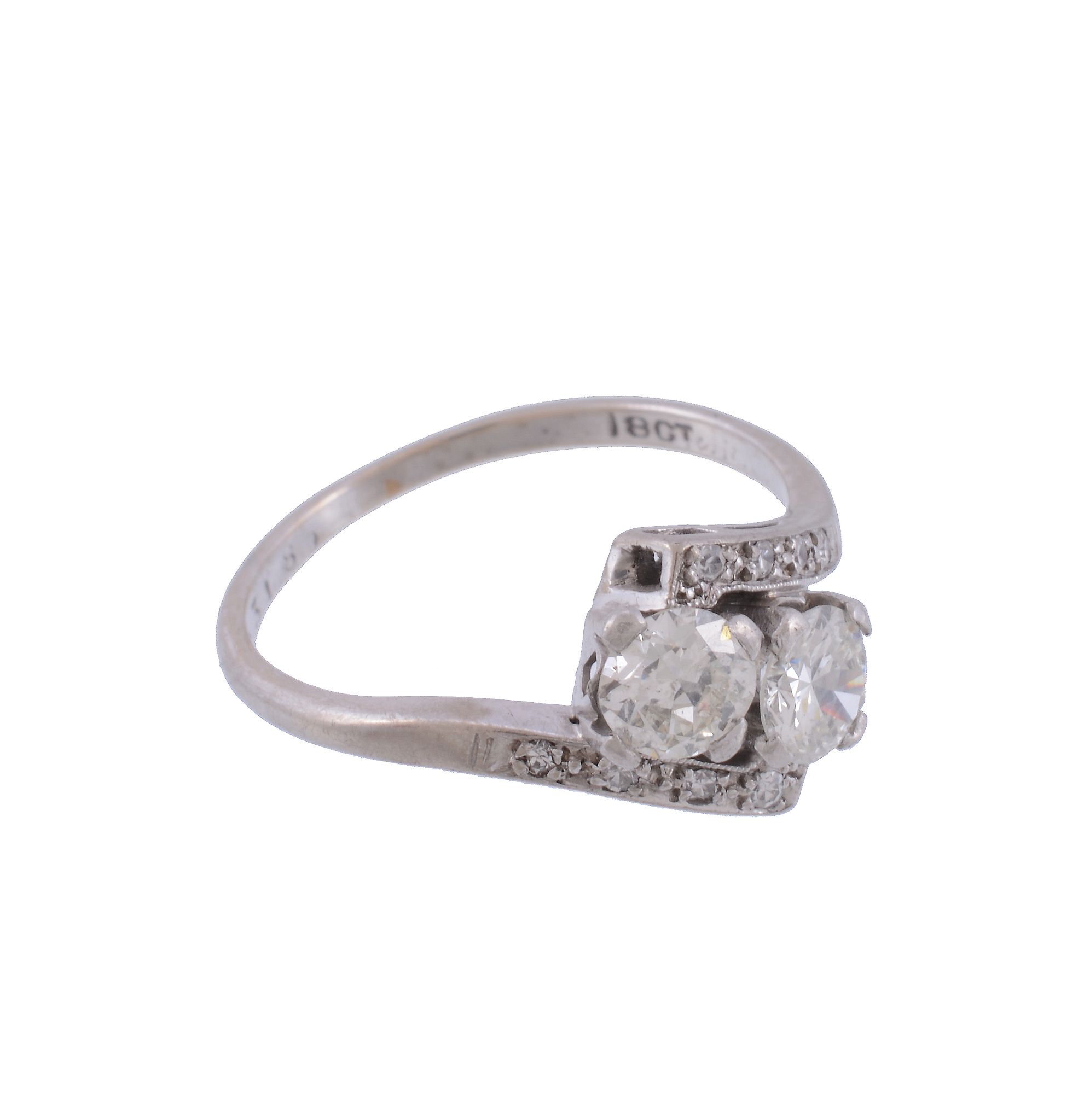 A two stone diamond ring, the crossover ring with two brilliant cut diamonds...   A two stone