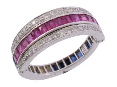 A ruby, sapphire and diamond 'night and day' eternity ring   A ruby, sapphire and diamond 'night and