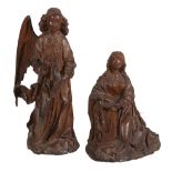 Two sculpted oak models of the Virgin and the Angel Gabriel forming the...   Two sculpted oak models