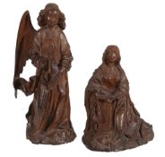 Two sculpted oak models of the Virgin and the Angel Gabriel forming the...   Two sculpted oak models