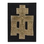 A Russian relief cast brass cross, Christ Crucified, late 18th century   A Russian relief cast brass