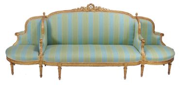 A carved giltwood framed sofa in Louis XVI style, second half 19th century   A carved giltwood