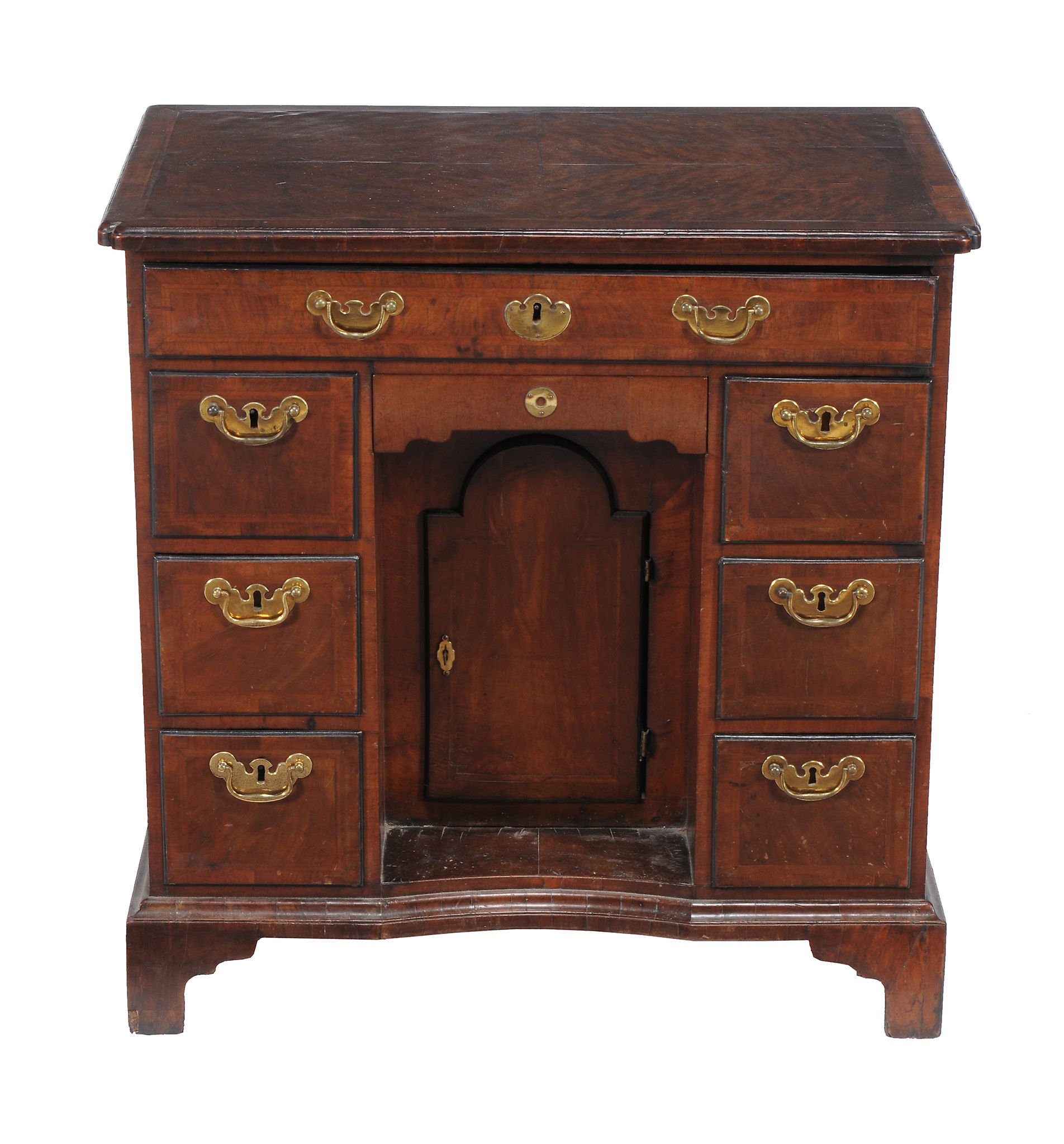 A George II walnut kneehole desk , circa 1735   A George II walnut kneehole desk  , circa 1735,