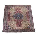A Tabriz carpet , the ivory field centred by an ultramarine medallion and...   A Tabriz carpet  ,
