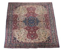 A Tabriz carpet , the ivory field centred by an ultramarine medallion and...   A Tabriz carpet  ,