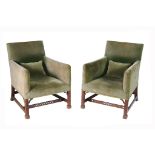 A matched pair of George III mahogany and upholstered armchairs , circa 1770   A matched pair of