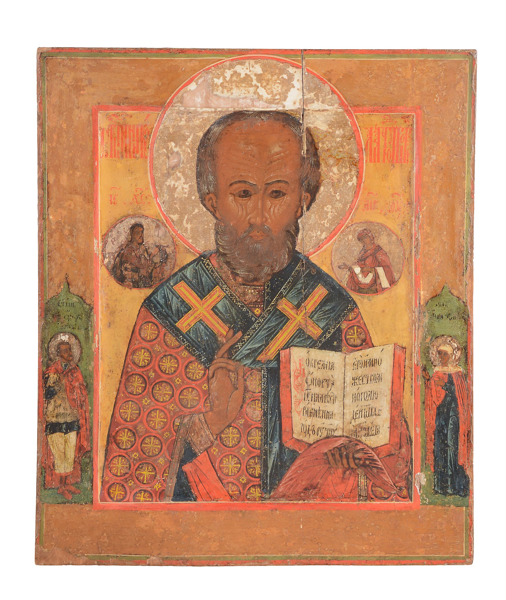 A Russian polychrome painted and parcel gilt icon, Saint Nicholas of Myra   A Russian polychrome