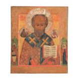 A Russian polychrome painted and parcel gilt icon, Saint Nicholas of Myra   A Russian polychrome