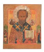 A Russian polychrome painted and parcel gilt icon, Saint Nicholas of Myra   A Russian polychrome