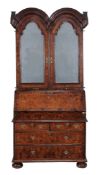 A Queen Anne walnut bureau bookcase , circa 1710   A Queen Anne walnut bureau bookcase  , circa